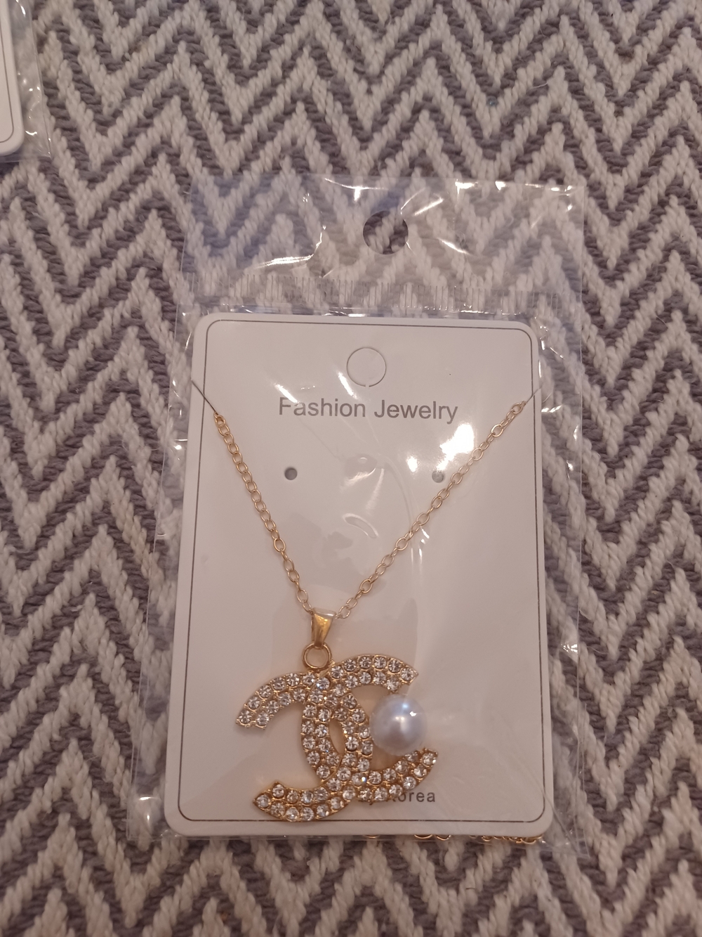Gold Crystal Interlocking Pendant Necklace with Pearl Accent